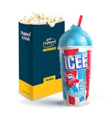 An ICEE beverage in front of a bag of popcorn