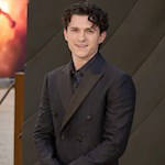 Why did Tom Holland find filming The Odyssey 'nostalgic and futuristic'?